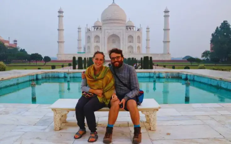Couple enjoying sunrise photo at Taj Mahal on taj-mahal-sunrise-tour-from-delhi-by-car