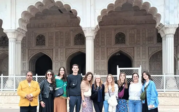 Golden Triangle Tour with Varanasi – Tourist group clicking photo at historical fort in Rajasthan