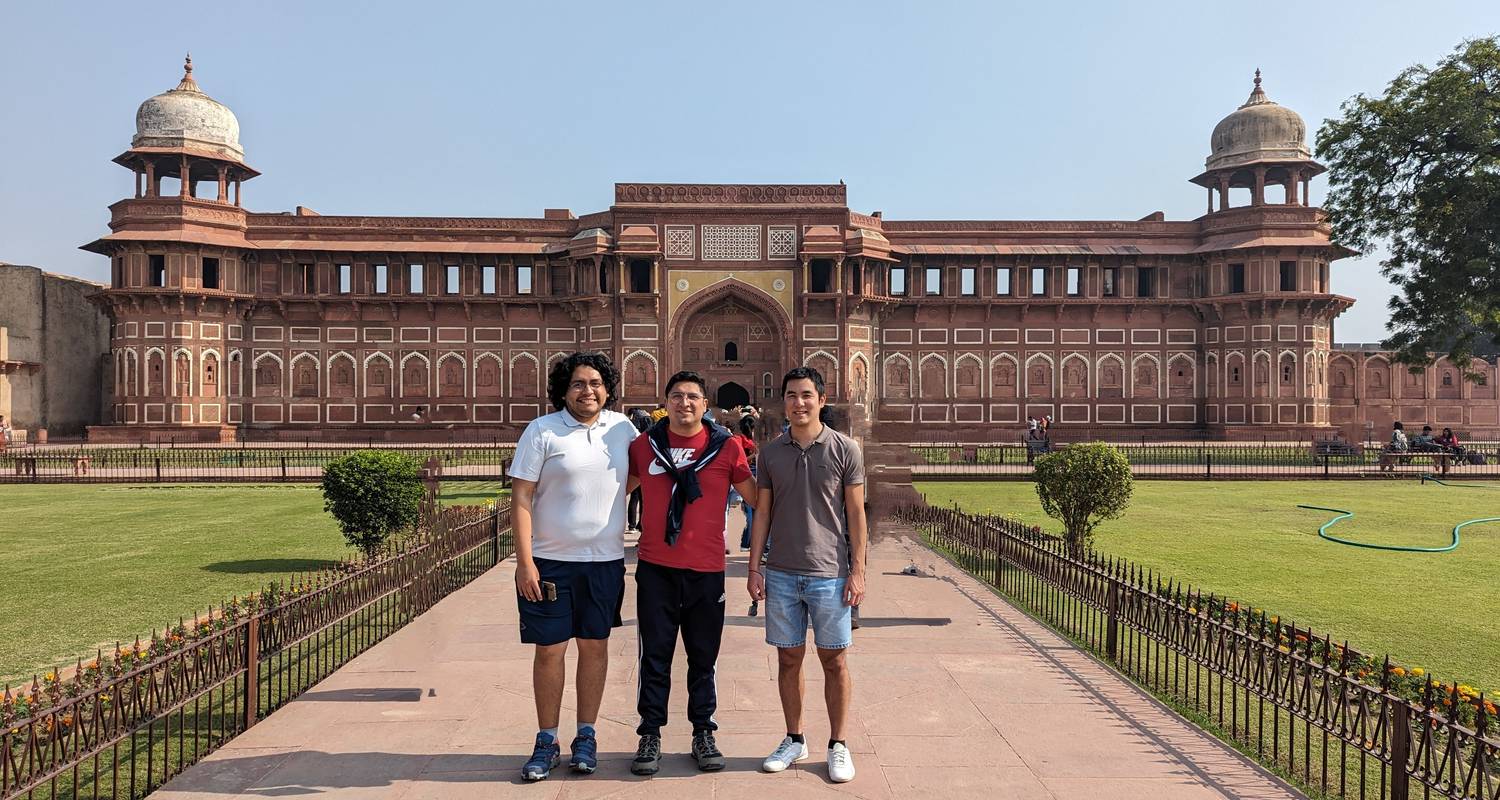 Group of friends posing at the Taj Mahal during the Same Day Taj Mahal Tour from Delhi by Namaste Yatra Tours
