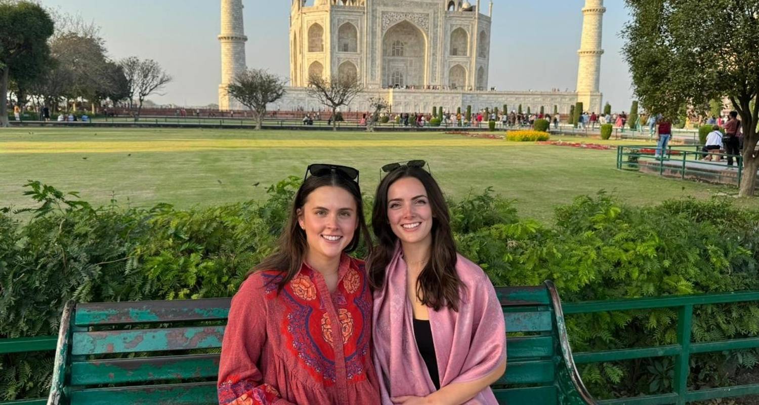 Family posing in front of the Taj Mahal during the Same Day Taj Mahal Tour from Delhi by Namaste Yatra Tours