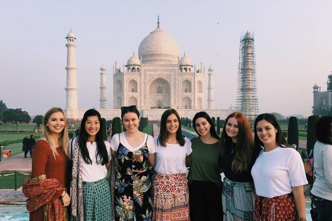 Tour group taking a photo in front of the Taj Mahal during the Golden Triangle Tour 3 Days with Namaste Yatra Tours